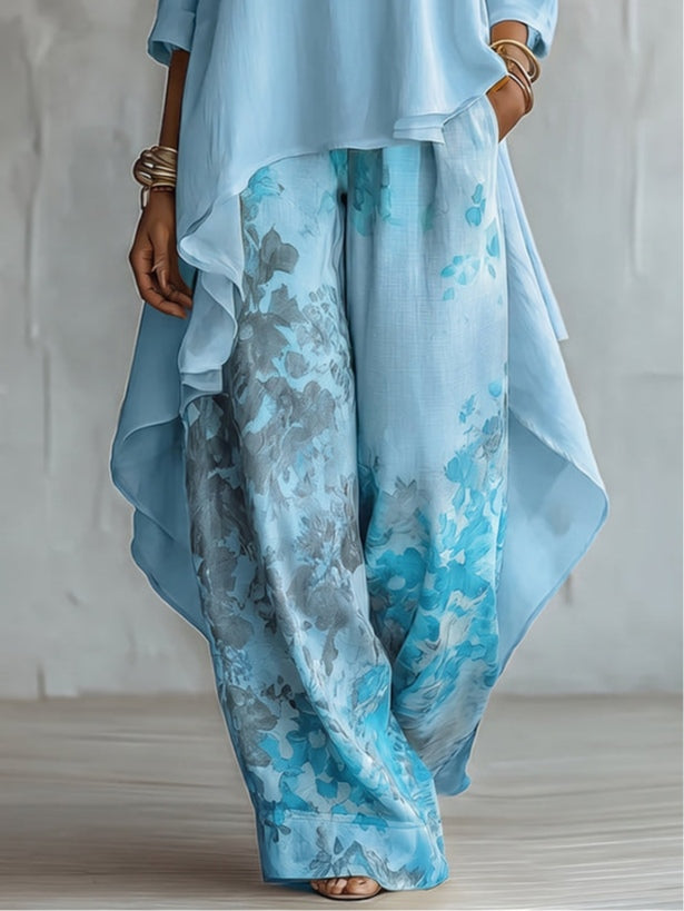 Caterina - Completo con top blu asimmetrico e pantaloni floreali a palazzo