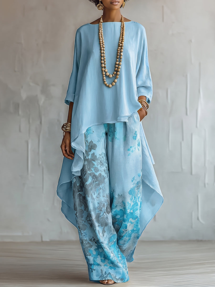 Caterina - Completo con top blu asimmetrico e pantaloni floreali a palazzo