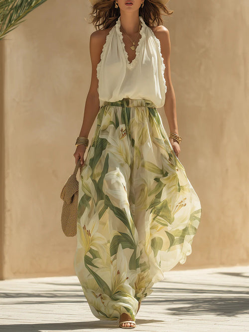 Cinzia - Completo da vacanza con top in chiffon senza maniche e volant e pantaloni a stampa di gigli