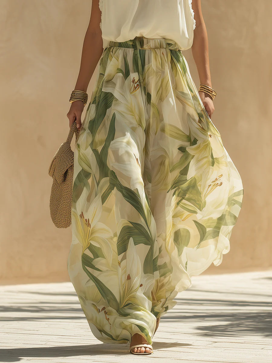 Cinzia - Completo da vacanza con top in chiffon senza maniche e volant e pantaloni a stampa di gigli
